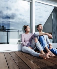 focused_488393696-stock-photo-mature-couple-relaxing-balcony-sunny